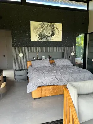 a bedroom with a large bed in a room at Luxurious Farm House Finca Libia in Guarne