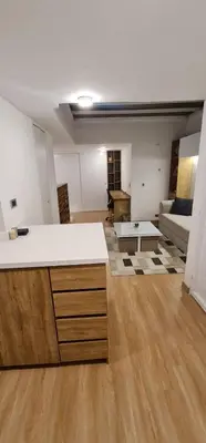 an empty living room with a couch and a table at Nomad Studio el Cable in Manizales