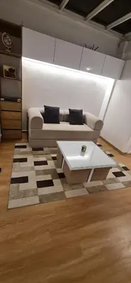 a living room with a couch and a coffee table at Nomad Studio el Cable in Manizales