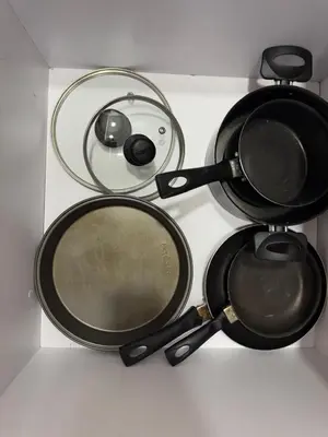 a group of pots and pans sitting on a table at Loft moderno en el Poblado con Aire acondicionado in Medellín