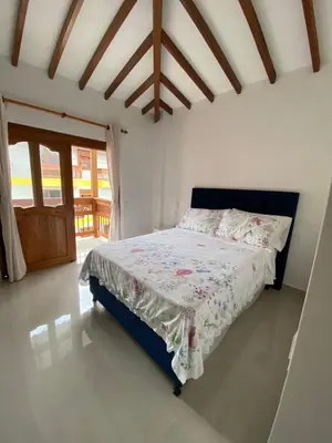 a bedroom with a bed in a room at Las Flores de María 302 in Jardin