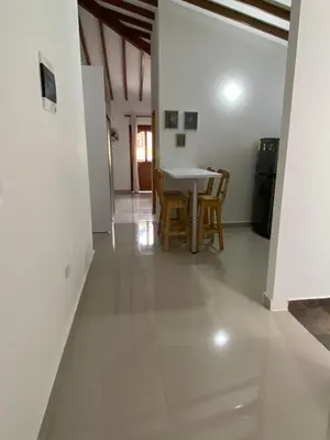 a kitchen and dining room with a table and chairs at Las Flores de María 302 in Jardin