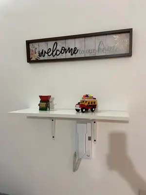 a shelf on a wall with a toy car on it at Las Flores de Mria 304 in Jardin