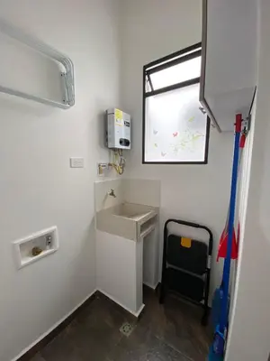 a small bathroom with a sink and a window at Las Flores de Mria 304 in Jardin