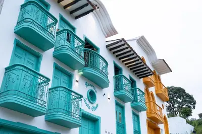 a building with blue balconies on it at Loft Moderno junto al Monasterio de Jericó in Jericó