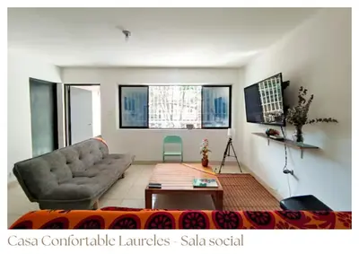 a living room with a couch and a table at Casas confortable Laureles in Medellín
