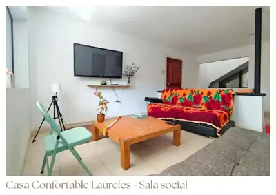 a living room with a couch and a table at Casas confortable Laureles in Medellín