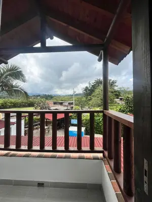 a balcony with a view of a pool at Hotel Kapla in San Rafael