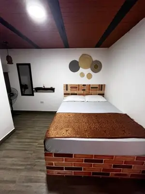 a bedroom with a brick bed in a room at Hotel Kapla in San Rafael