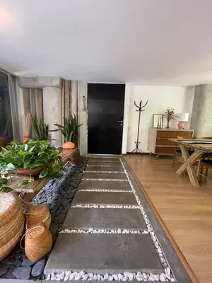 a living room with a rug on the floor at Modern & Calm Stay Near Provenza in Medellín