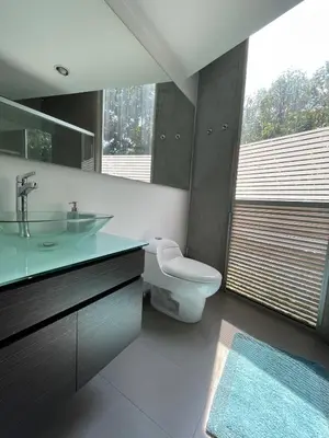 a bathroom with a sink and a toilet and a window at Modern & Calm Stay Near Provenza in Medellín