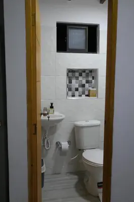 a bathroom with a toilet and a sink at Single studio apartment 4 in Medellín