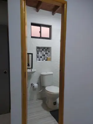 a bathroom with a toilet and a sink at Single studio apartment 4 in Medellín