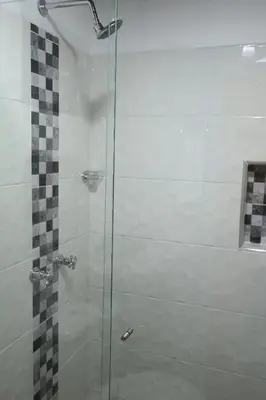 a bathroom with a shower with a glass door at Single studio apartment 4 in Medellín