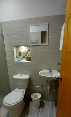 a bathroom with a toilet and a sink at individual studio apartment 3 in Medellín