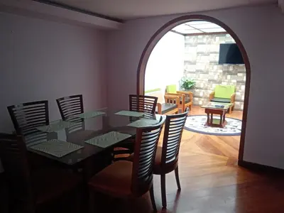 a dining room with a glass table and chairs at Casa acogedora y excelente ubicación in Manizales