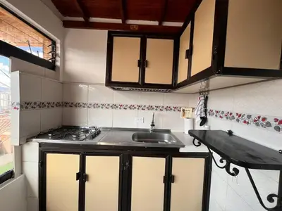 a kitchen with a sink and a counter top at Apartment near downtown in Medellín