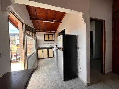 a kitchen with a black refrigerator in a room at Apartment near downtown in Medellín