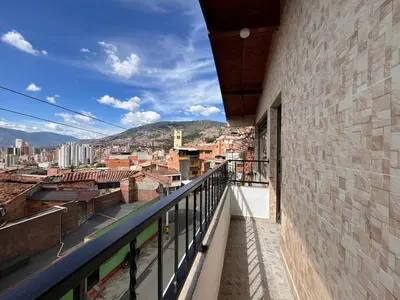 a balcony with a view of a city at Apartment near downtown in Medellín