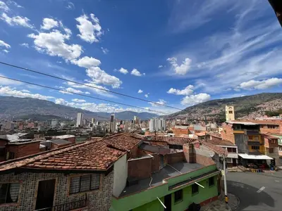 a view of a city from the roofs of buildings at Apartment near downtown in Medellín