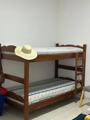 a hat sitting on top of a bunk bed at Finca Pacora in Palestina
