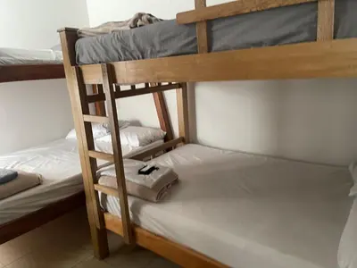 a couple of bunk beds in a room at Apartasol santafe live in Santa Fe de Antioquia