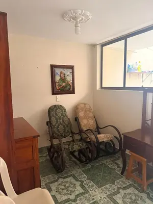 a waiting room with two chairs and a window at Casa en Urrao Antioquía in Urrao