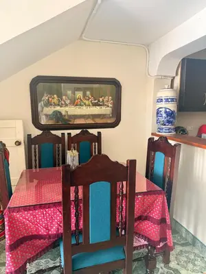 a dining room with a table and a mirror at Casa en Urrao Antioquía in Urrao