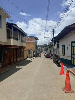 an empty street with orange cones in a town at Casa en Urrao Antioquía in Urrao