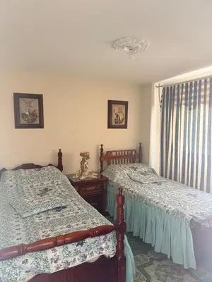 a bedroom with two beds and a window at Casa en Urrao Antioquía in Urrao