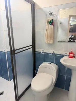a bathroom with a toilet and a sink at Casa en Urrao Antioquía in Urrao