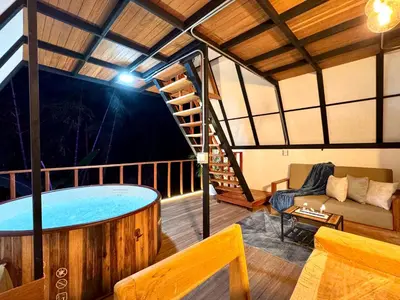 a large room with a hot tub on a balcony at Cabaña con jacuzzi en Venecia in Venecia