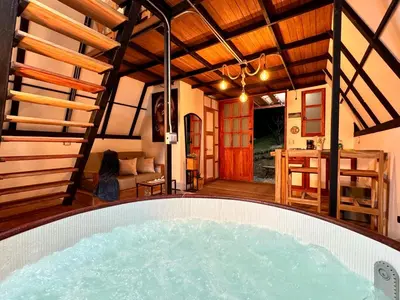 a room with a hot tub in the middle of a house at Cabaña con jacuzzi en Venecia in Venecia