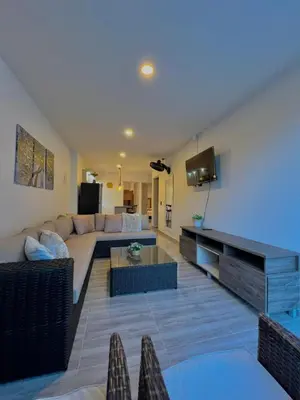 a living room with a couch and a tv at Casa N-26 Mira in Sopetran