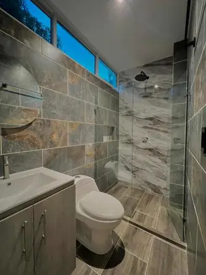 a bathroom with a toilet and a sink and a shower at Casa N-26 Mira in Sopetran