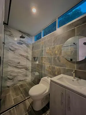 a bathroom with a toilet and a sink at Casa N-26 Mira in Sopetran