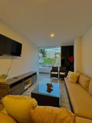 a living room with a couch and a flat screen tv at Casa N-26 Mira in Sopetran