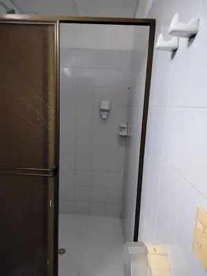 a shower stall with a toilet in a bathroom at Hotel Galerias in Ruiosucio