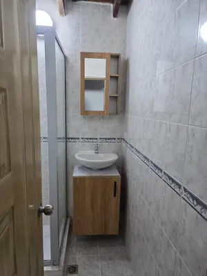 a bathroom with a sink and a mirror at Apartamento completo cerca del estadio in Medellín