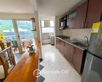 a kitchen with a sink and a counter top at Spacious apartment near Lleras and Provenza rentalsOP AN08 in Medellín
