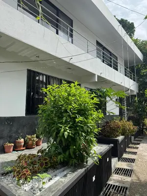 a building with plants in front of it at Casa Bosque Vivo in Norcasia