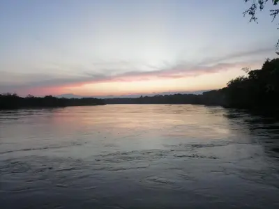 a view of a river at sunset at Casa Zona Rosa in La Dorada