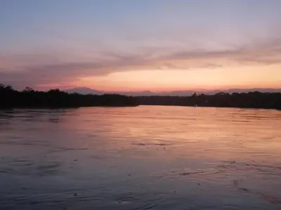 a view of a river at sunset at Casa Zona Rosa in La Dorada