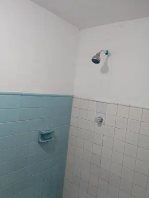 a bathroom with a shower with a faucet at Casa Zona Rosa in La Dorada