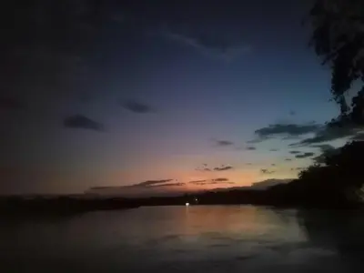 a sunset over a river with the sky at Casa Zona Rosa in La Dorada