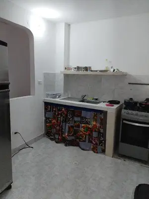 a kitchen with a sink and a stove at Casa Zona Rosa in La Dorada