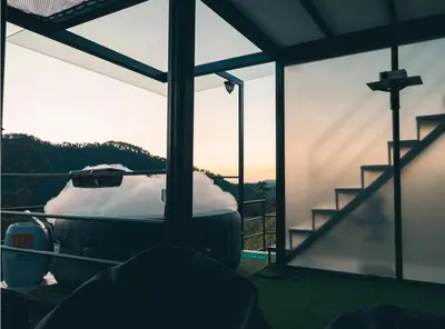 a room with a view of a mountain through a window at Glamping La Maestranza con desayuno incluido in Estación El Salto