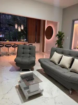 a living room with a couch and a table at Medellin La 70 - Laureles in Medellín