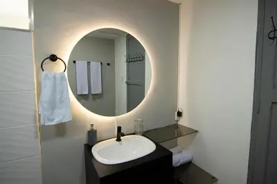 a bathroom with a sink and a mirror at Medellin La 70 - Laureles in Medellín