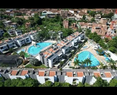 an aerial view of a resort with two swimming pools at Apartasol por días en condominio ciudadela Santa Fe de Antioquia in Santa Fe de Antioquia